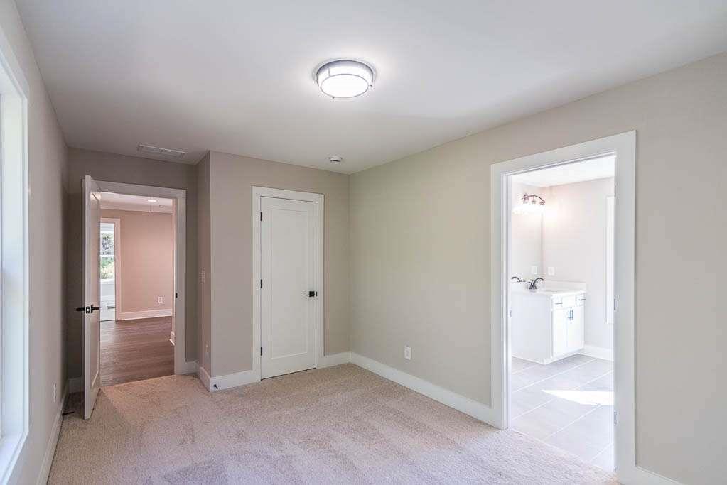 2462 Waldrop Ridge Court Decatur, GA 30034 - Photo 20 of 20 an empty room with closet and mirror