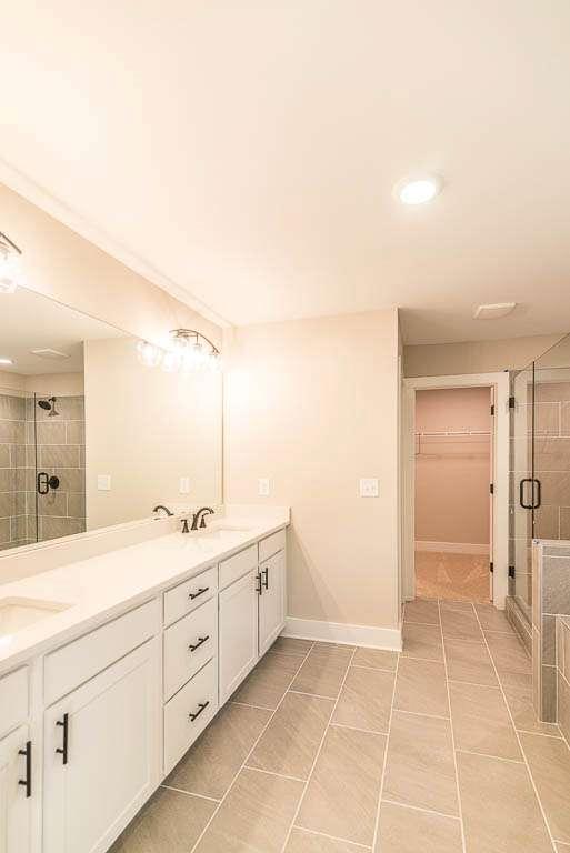 2462 Waldrop Ridge Court Decatur, GA 30034 - Photo 10 of 20 a spacious bathroom with a granite countertop sink a mirror and a