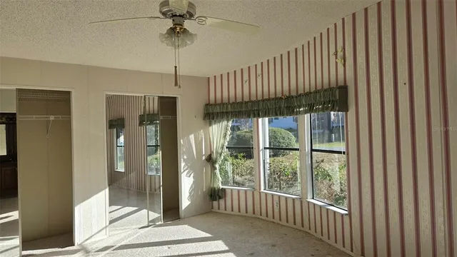 a very nice looking room with a large window and glass door