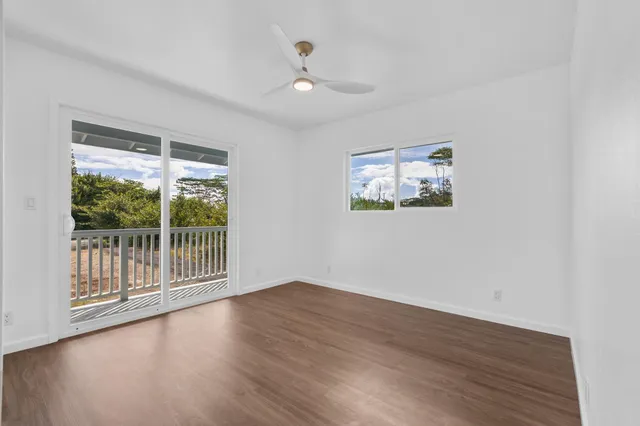 a view of wooden floor and a chandelier in a room