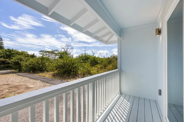 a view of a balcony with wooden floor