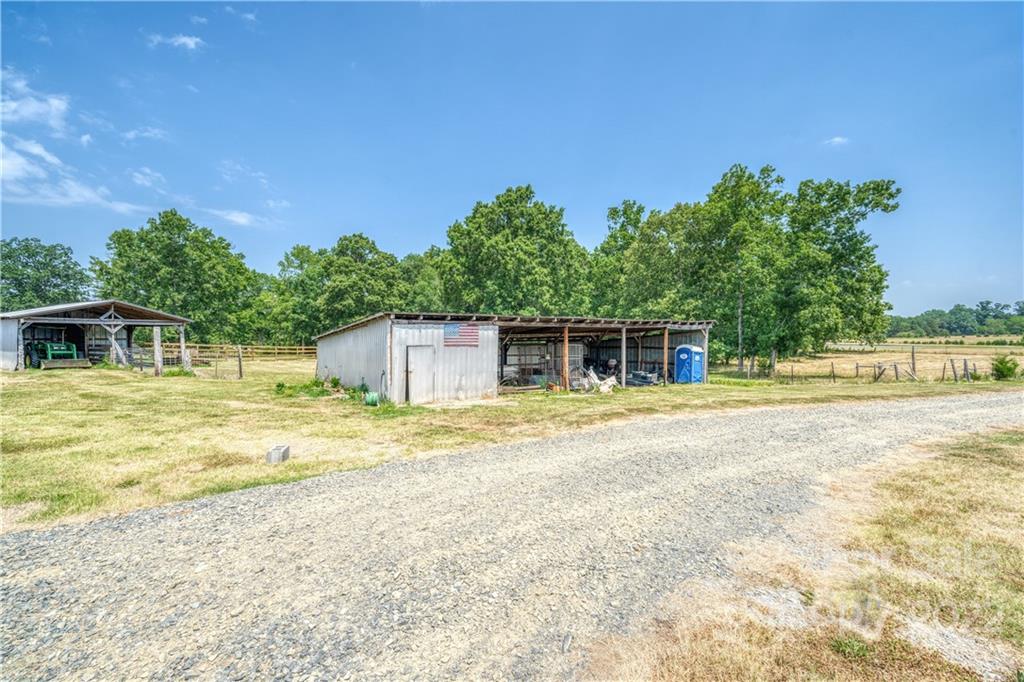 8681 Mauney Road Mount Pleasant, NC 28124 - Photo 27 of 46 a swimming pool with trees in the background