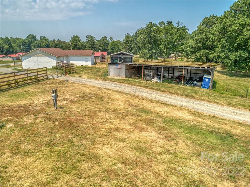 8681 Mauney Road Mount Pleasant, NC 28124 - Photo 28 of 46 a swimming pool with outdoor seating and yard