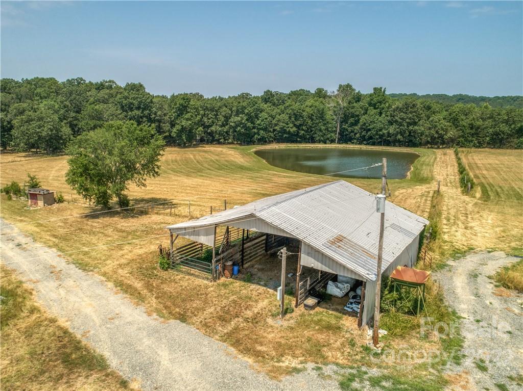 8681 Mauney Road Mount Pleasant, NC 28124 - Photo 30 of 46 a view of a swimming pool with an outdoor seating and yard