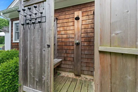a view of a wooden door with a glass door