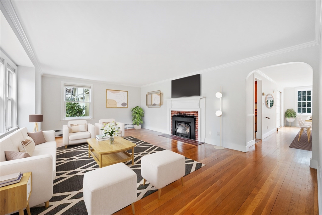 14 Somerset Road Lexington, MA 02420 - Photo 2 of 42 a living room with furniture a fireplace and a wooden floor