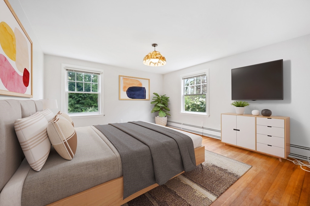 14 Somerset Road Lexington, MA 02420 - Photo 23 of 42 a bedroom with a bed and a flat screen tv