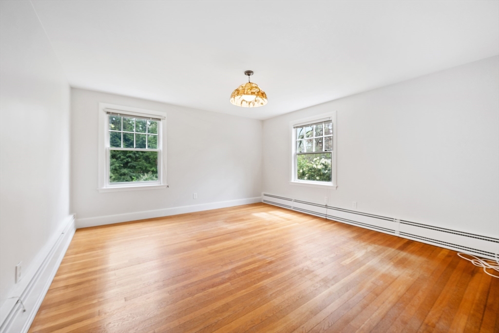 14 Somerset Road Lexington, MA 02420 - Photo 24 of 42 wooden floor in an empty room with a window