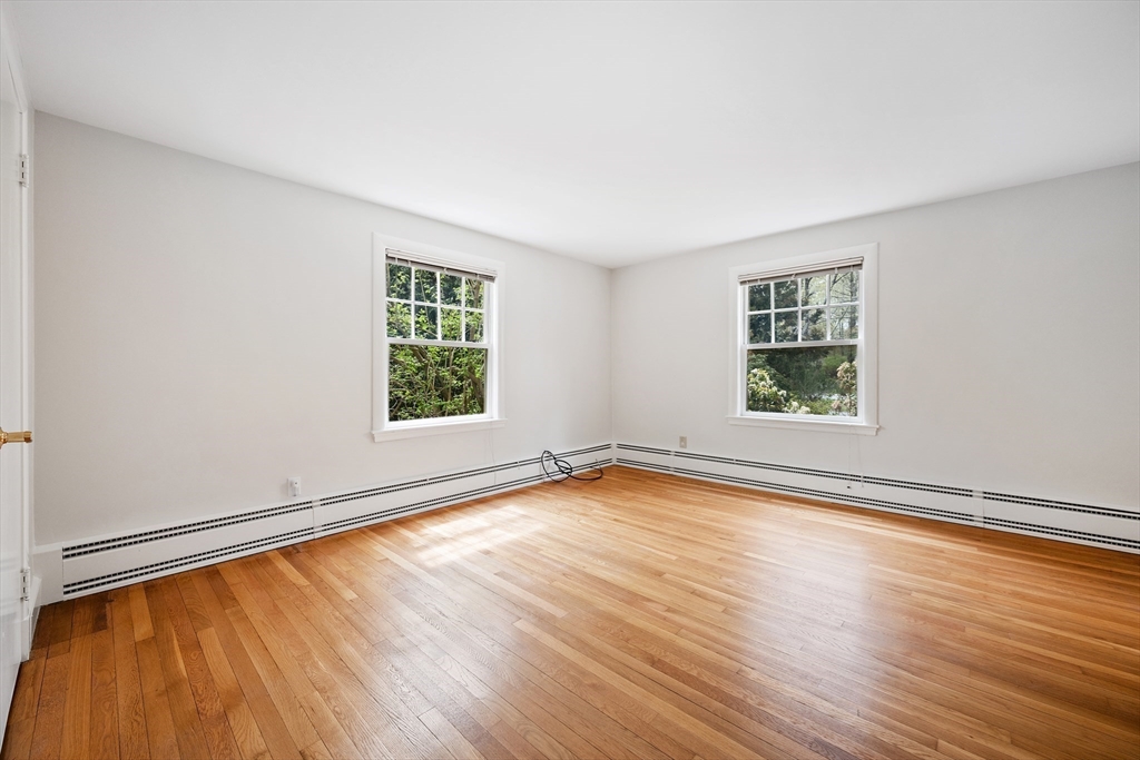 14 Somerset Road Lexington, MA 02420 - Photo 25 of 42 an empty room with wooden floor and windows