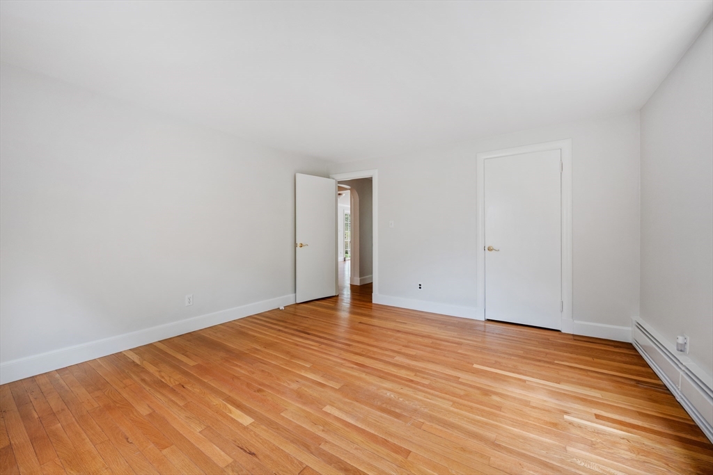 14 Somerset Road Lexington, MA 02420 - Photo 26 of 42 a view of an empty room with wooden floor