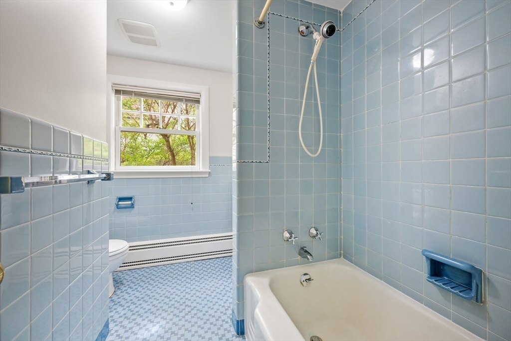 14 Somerset Road Lexington, MA 02420 - Photo 27 of 42 a bathroom with a tub a window and a shower