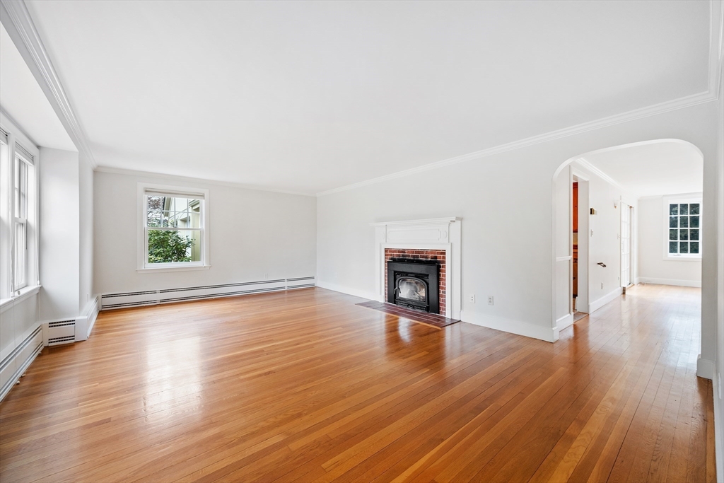 14 Somerset Road Lexington, MA 02420 - Photo 3 of 42 an empty room with wooden floor and windows