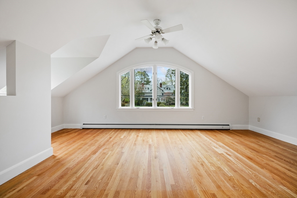 14 Somerset Road Lexington, MA 02420 - Photo 32 of 42 an empty room with wooden floor chandelier and windows