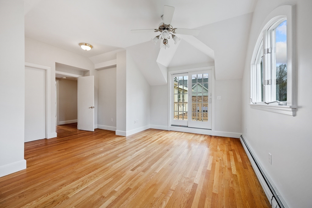 14 Somerset Road Lexington, MA 02420 - Photo 33 of 42 a view of an empty room with wooden floor and a window