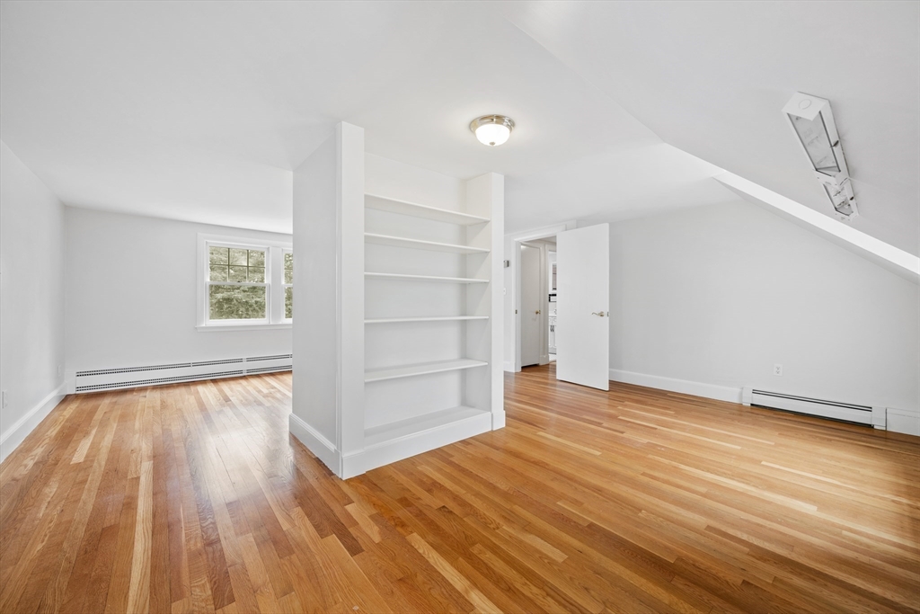 14 Somerset Road Lexington, MA 02420 - Photo 35 of 42 a view of an empty room with wooden floor and a window