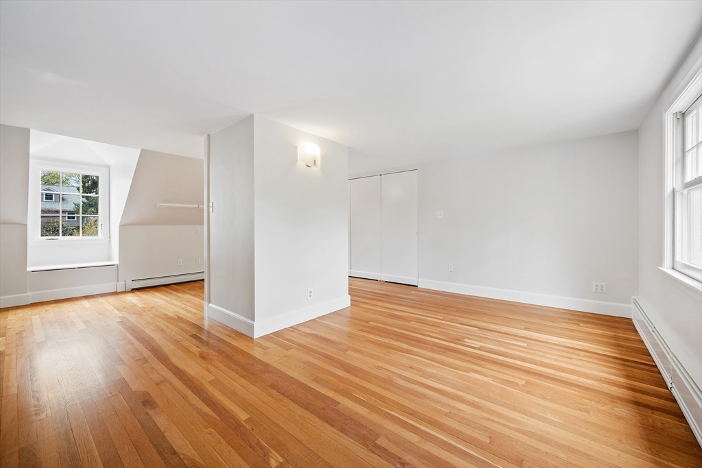 14 Somerset Road Lexington, MA 02420 - Photo 36 of 42 an empty room with wooden floor and windows