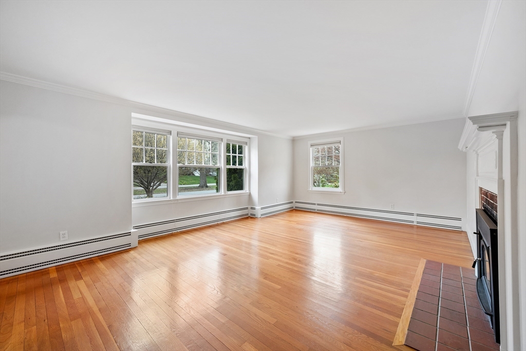 14 Somerset Road Lexington, MA 02420 - Photo 6 of 42 a view of an empty room with a window and wooden floor