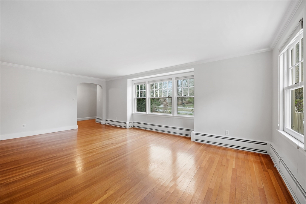 14 Somerset Road Lexington, MA 02420 - Photo 7 of 42 an empty room with wooden floor and windows
