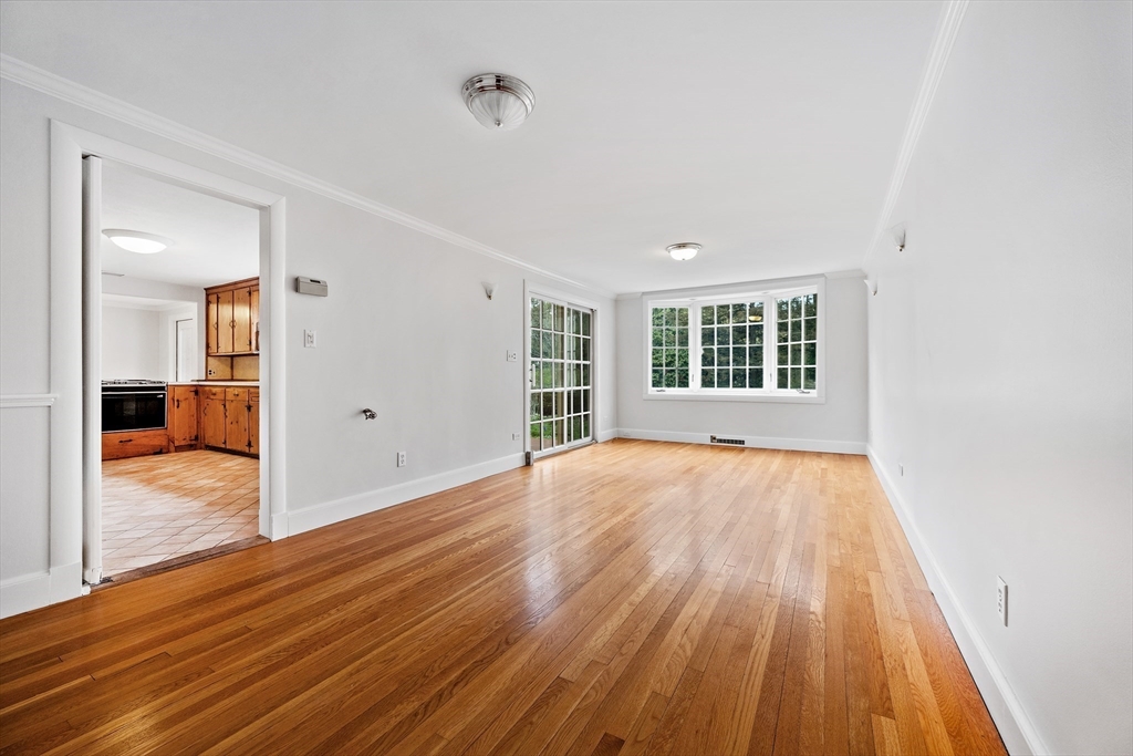 14 Somerset Road Lexington, MA 02420 - Photo 8 of 42 an empty room with wooden floor and windows