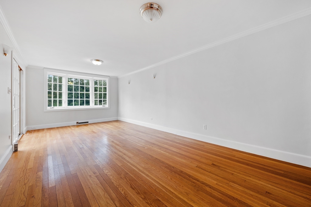 14 Somerset Road Lexington, MA 02420 - Photo 9 of 42 wooden floor in an empty room with a window