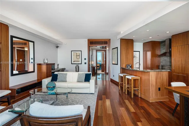 a living room with furniture a fireplace and a table