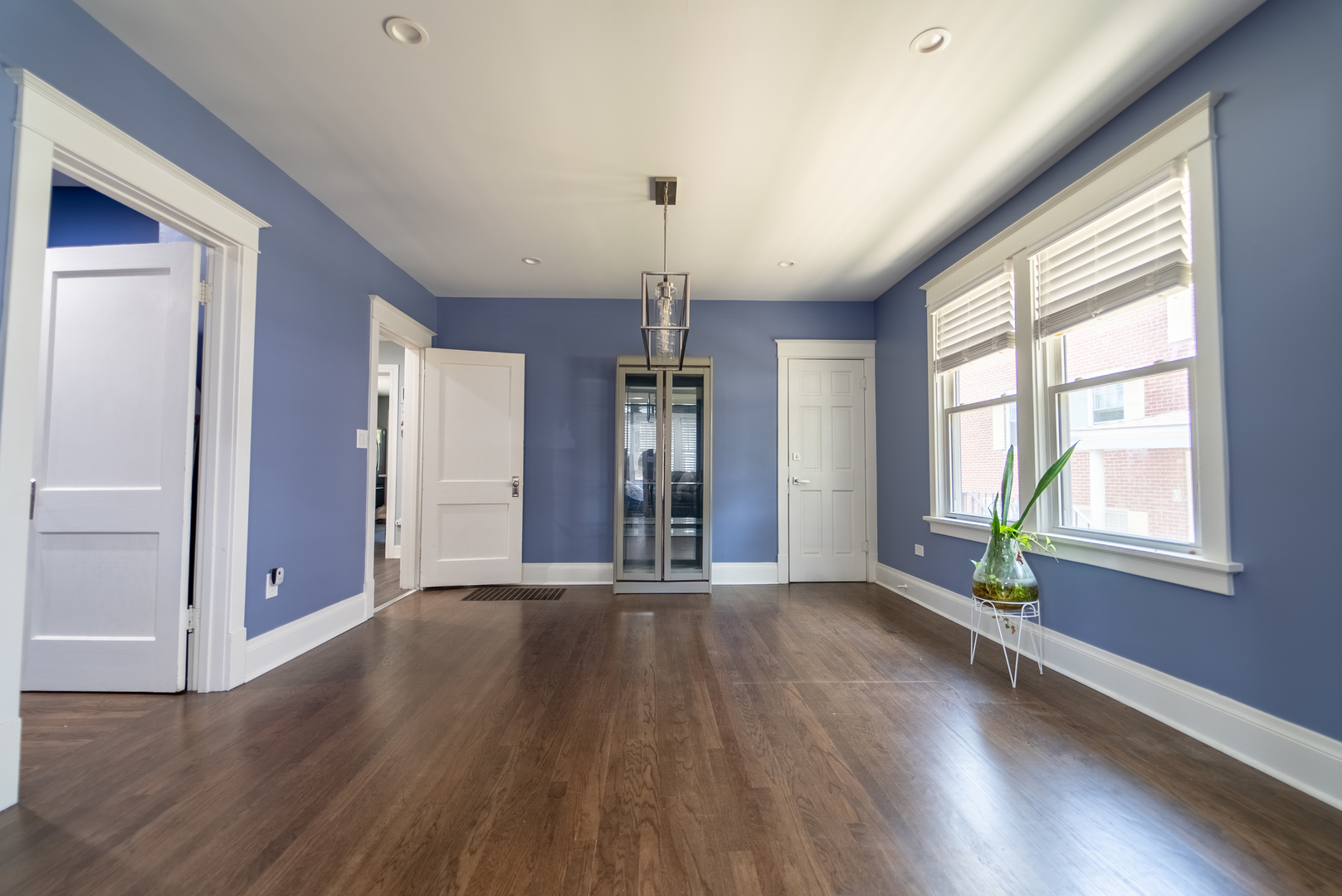 118 East North Avenue Addison, IL 60101 - Photo 12 of 50 an empty room with wooden floor chandelier and windows