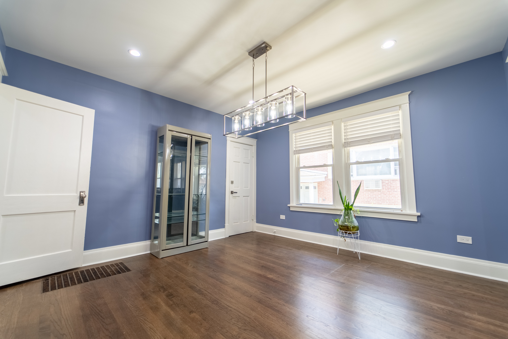 118 East North Avenue Addison, IL 60101 - Photo 13 of 50 an empty room with wooden floor and windows