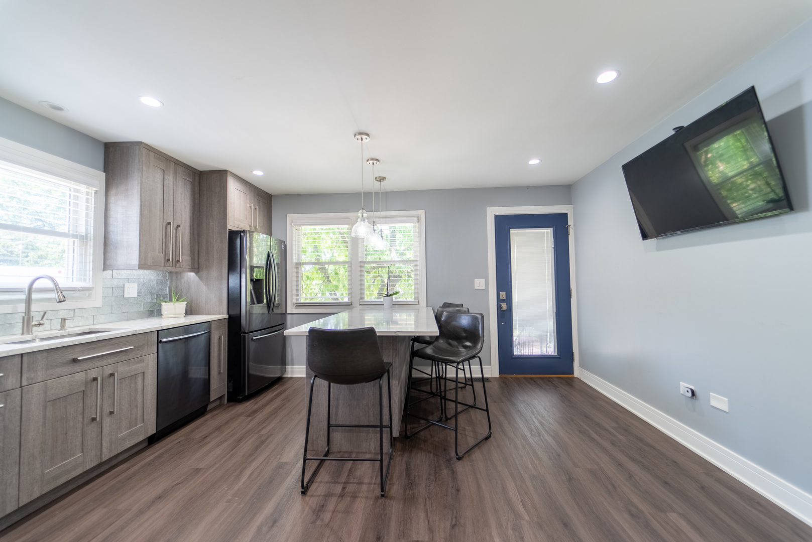 118 East North Avenue Addison, IL 60101 - Photo 17 of 50 a kitchen with sink cabinets and wooden floor