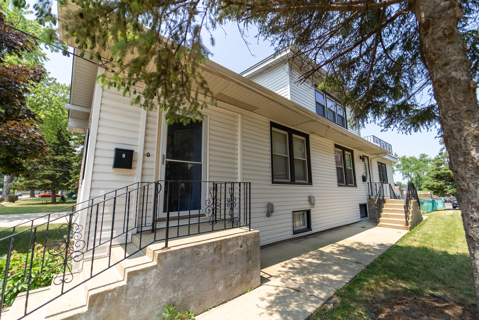 118 East North Avenue Addison, IL 60101 - Photo 2 of 50 a front view of a house with a yard