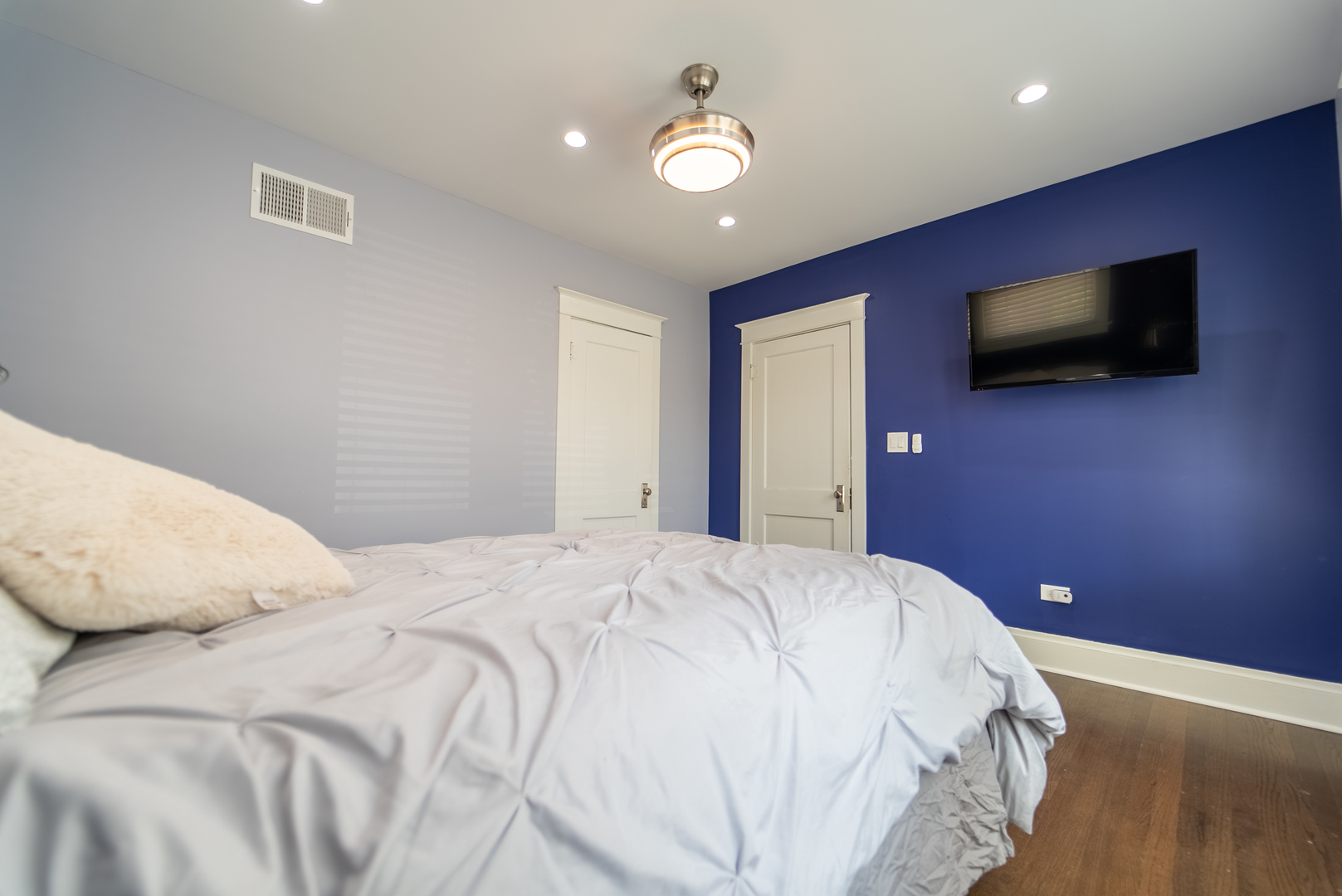 118 East North Avenue Addison, IL 60101 - Photo 23 of 50 a bedroom with a bed and a flat screen tv