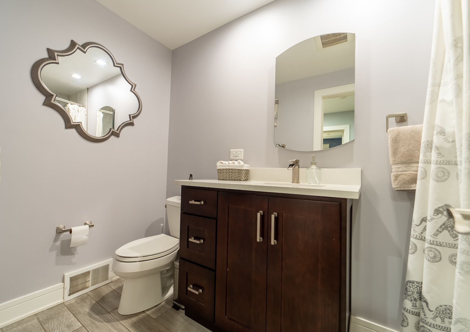 118 East North Avenue Addison, IL 60101 - Photo 30 of 50 a bathroom with a sink a toilet and a mirror