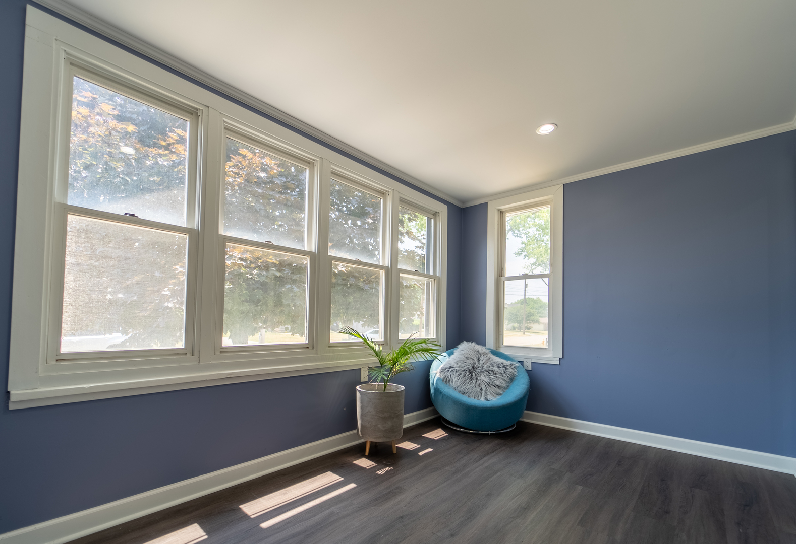 118 East North Avenue Addison, IL 60101 - Photo 4 of 50 a view of an empty room with a window and wooden floor