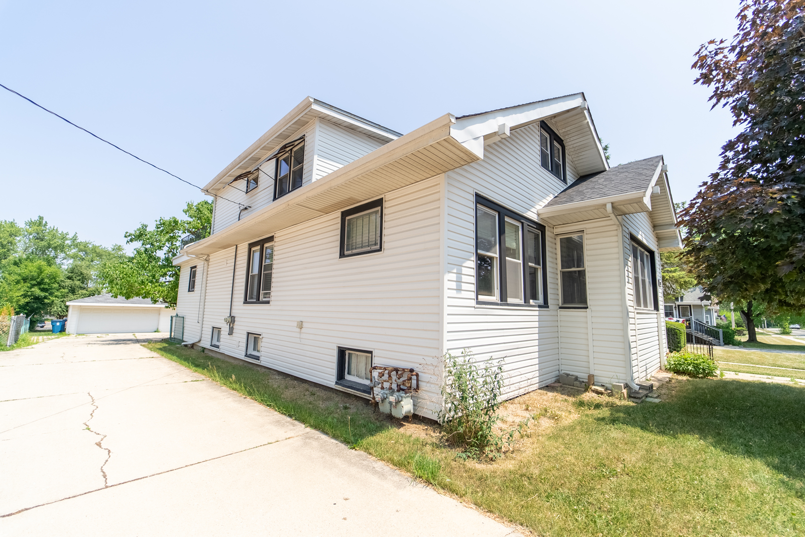 118 East North Avenue Addison, IL 60101 - Photo 46 of 50 a view of a white house with a yard
