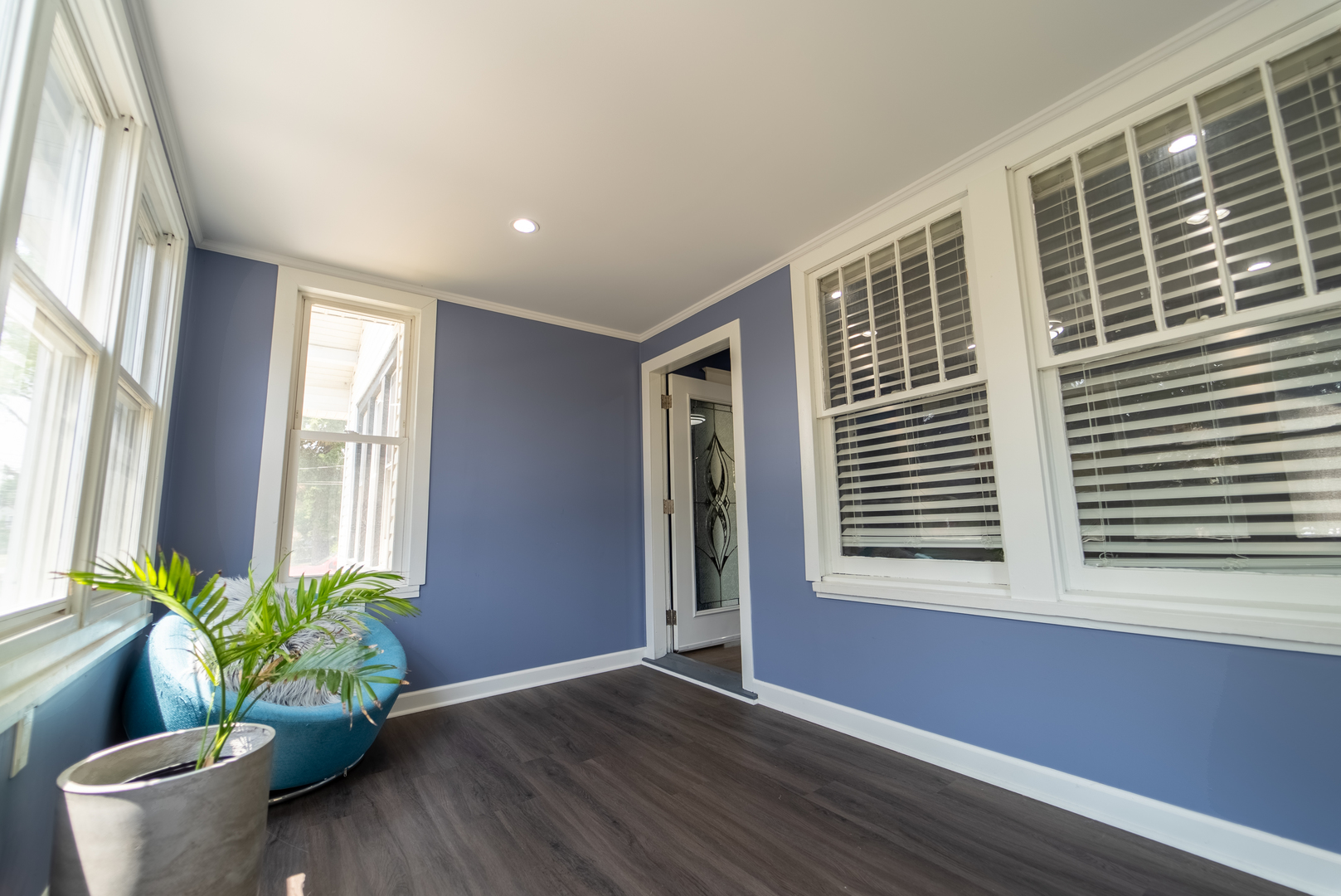118 East North Avenue Addison, IL 60101 - Photo 5 of 50 a view of an empty room with a window and wooden floor