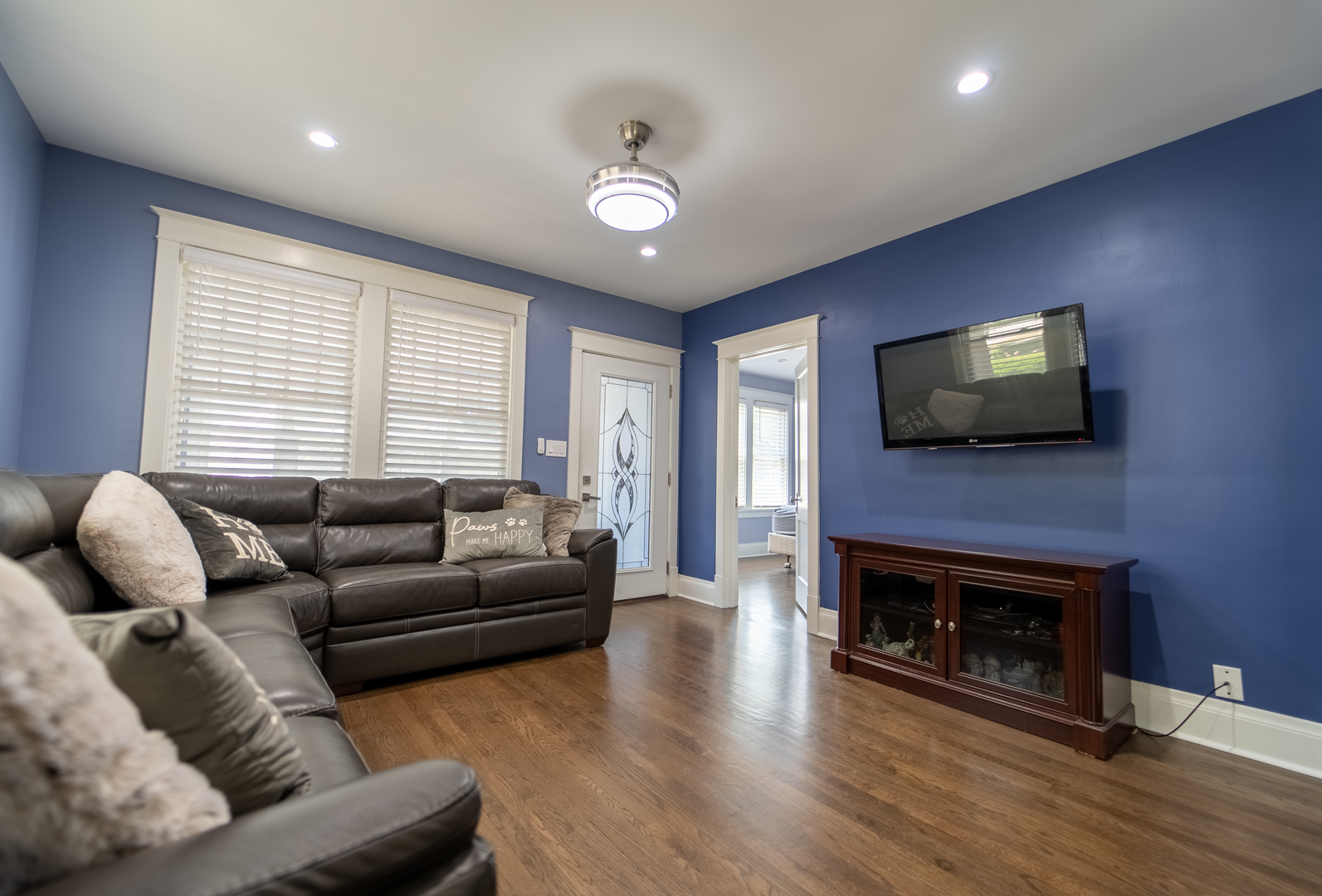 118 East North Avenue Addison, IL 60101 - Photo 7 of 50 a living room with furniture a flat screen tv and a fireplace