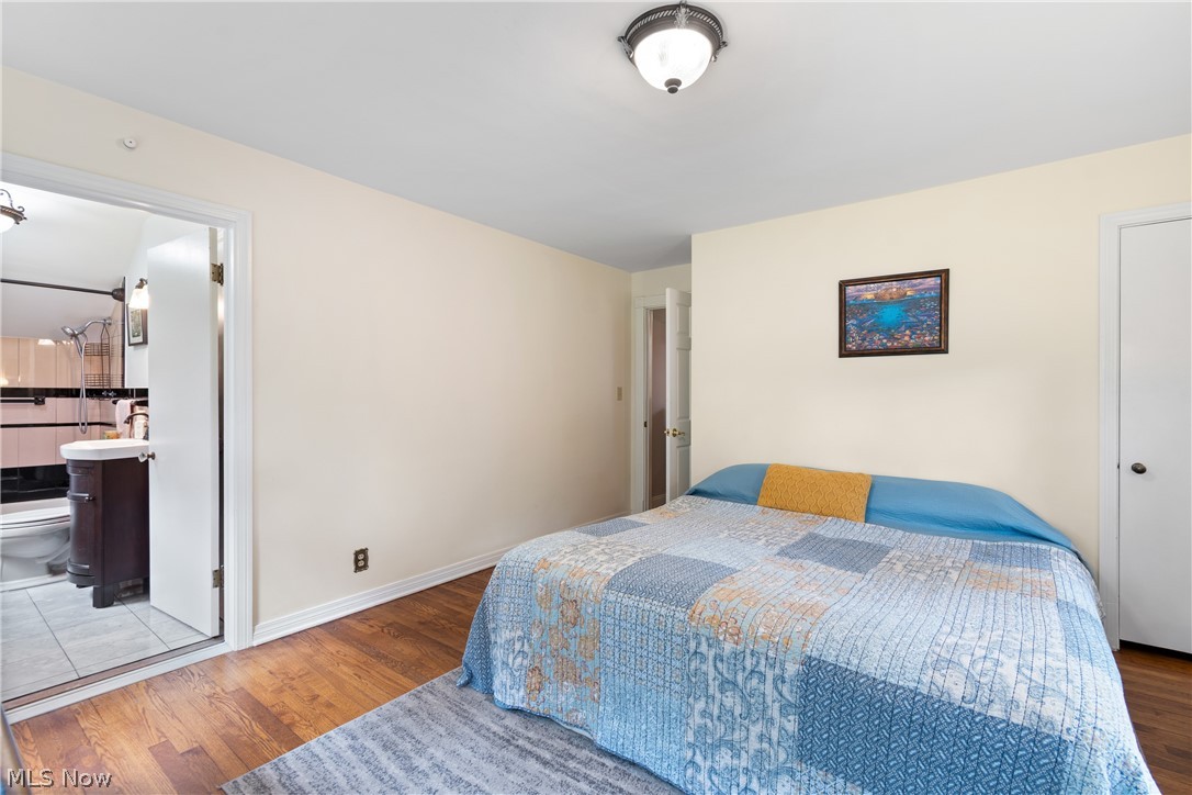 443 Merriman Road Akron, OH 44303 - Photo 24 of 44 Bedroom featuring wood-finish flooring, light-toned walls, and a ceiling-mounted light fixture