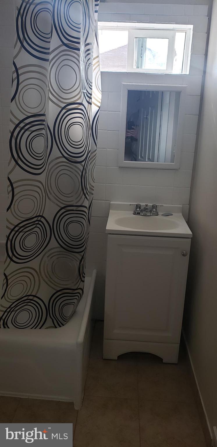 3054 Alabama Road Camden, NJ 08104 - Photo 12 of 25 a utility room with a stove
