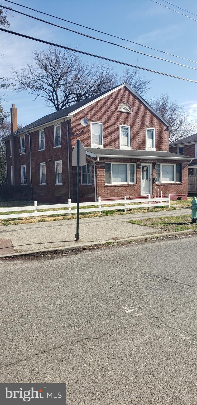 3054 Alabama Road Camden, NJ 08104 - Photo 4 of 25 a front view of a house with a yard