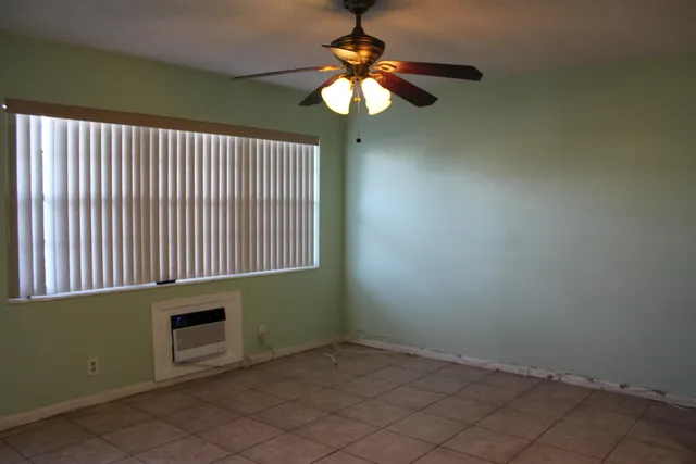 a view of a livingroom with a chandelier fan