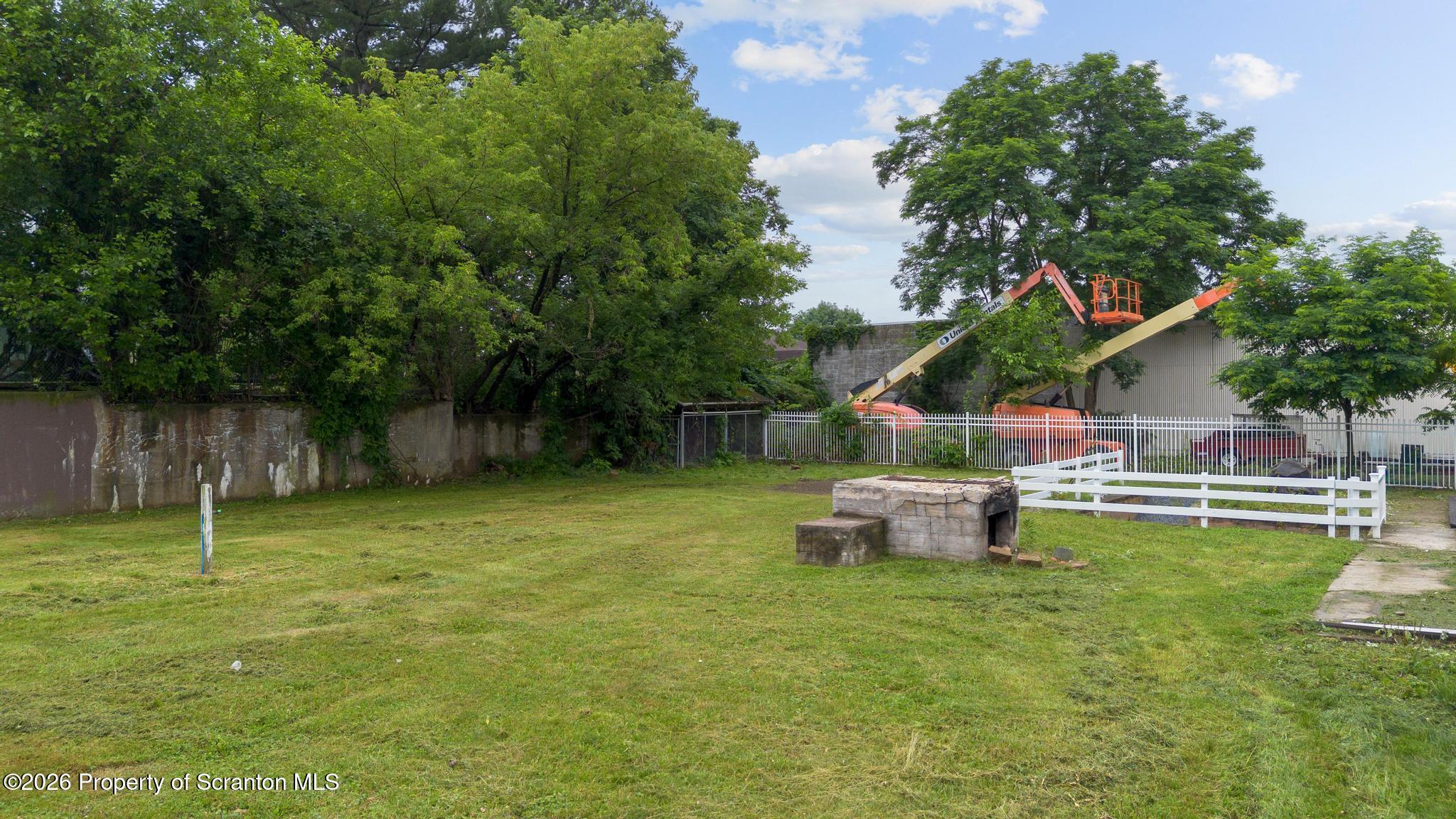 116 Forge Street Old Forge, PA 18518 - Photo 49 of 49 a garden view with a seating space