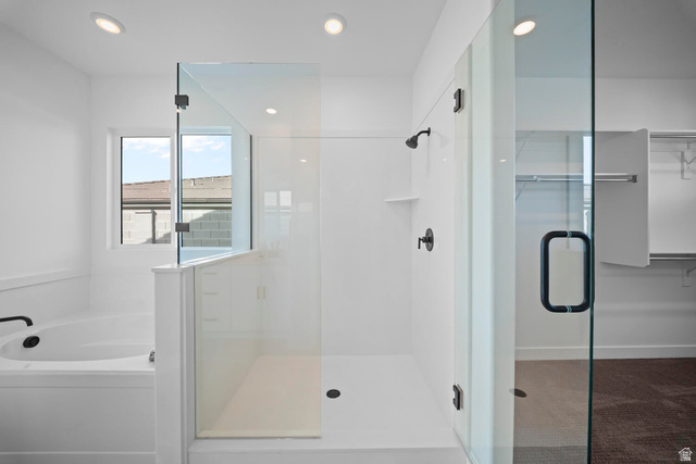 382 North Rhyolite Drive, Unit 111 Hurricane, UT 84737 - Photo 17 of 37 Walk-in shower with clear glass enclosure and matte black fixtures