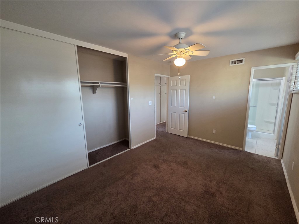8317 Hudson Drive San Diego, CA 92119 - Photo 12 of 26 a view of empty room with a ceiling fan and window