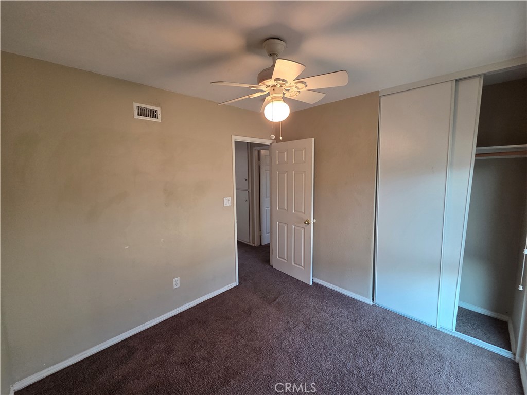 8317 Hudson Drive San Diego, CA 92119 - Photo 16 of 26 a view of a chandelier fan and refrigerator in a room
