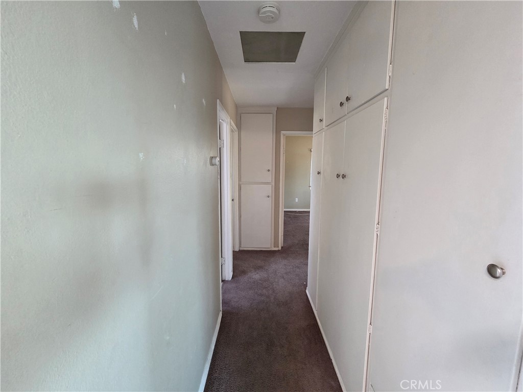 8317 Hudson Drive San Diego, CA 92119 - Photo 8 of 26 a view of a hallway with wooden floor