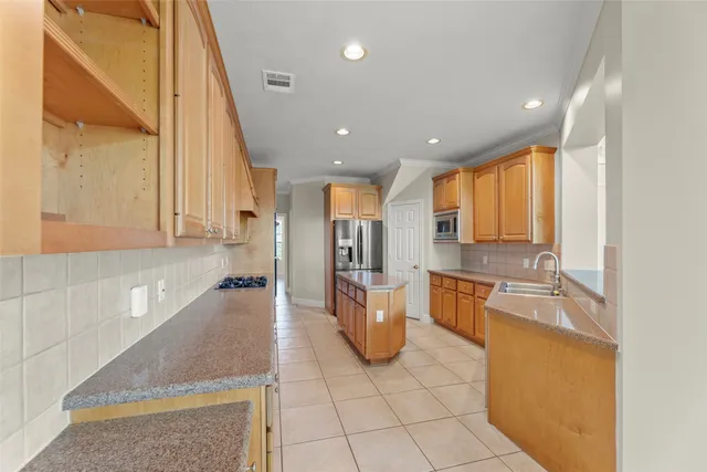 a open kitchen with a sink and dishwasher a oven with granite countertops