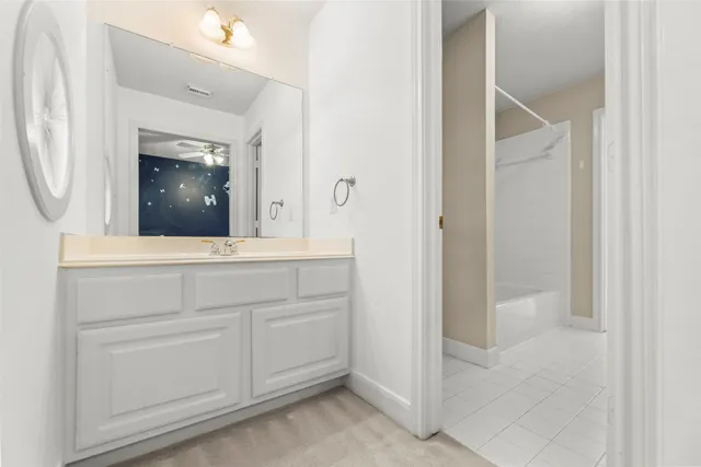 a bathroom with a bathtub and a sink