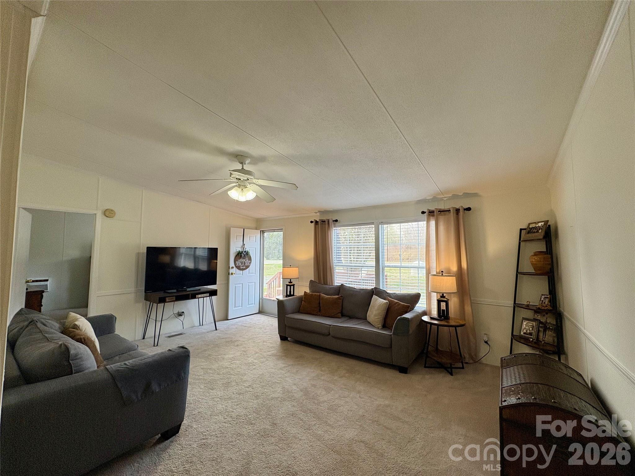 3422 Edwards Road Wingate, NC 28174 - Photo 12 of 31 a living room with furniture and a flat screen tv