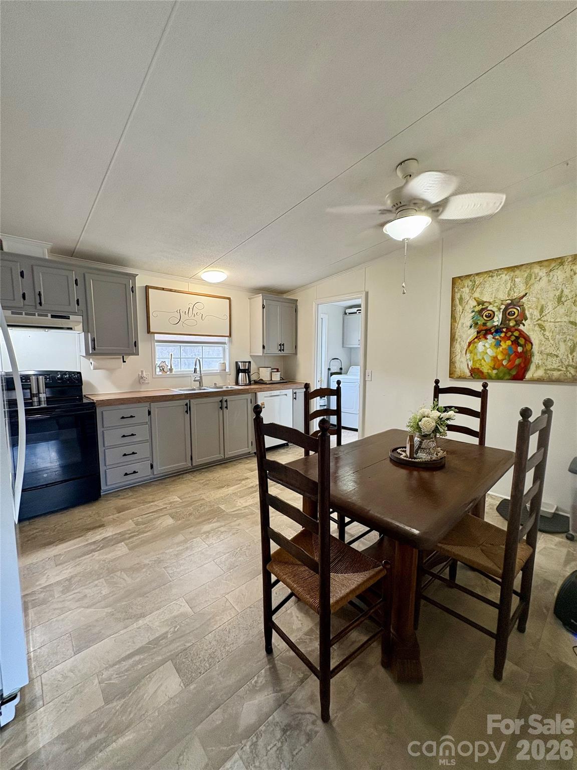 3422 Edwards Road Wingate, NC 28174 - Photo 20 of 31 a view of a dining room with furniture and a chandelier