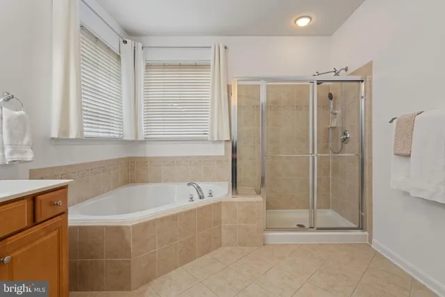 a bathroom with a bathtub and shower