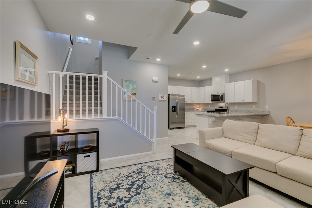 2870 Turnstone Ridge Street Henderson, NV 89044 - Photo 13 of 50 Living area with stairway, ceiling fan, recessed lighting, and baseboards